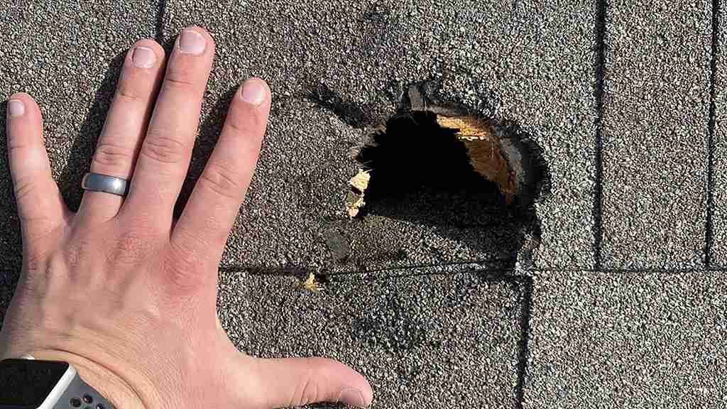 Extreme Hail Damage on a Roof in Central Texas Extreme damage to a residential roof from a large hailstorm puncture on a home in Austin Texas