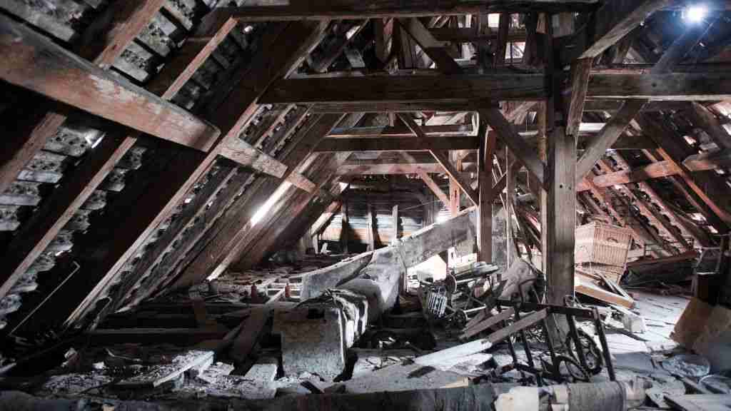 Extreme Hail Damage on a Roof in Central Texas Light leaking through a roof into the attic area