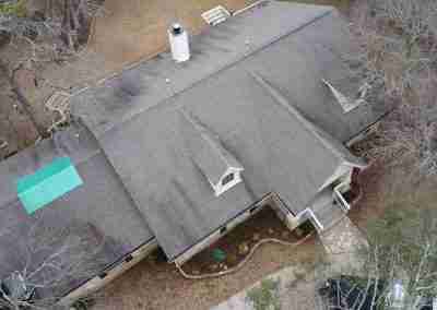 A storm damaged roof that we repaired and then did a full shingle replacement on a home in Leander Texas.
