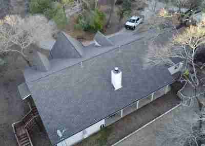 A storm damaged roof that we repaired and then did a full shingle replacement on a home in Leander Texas.