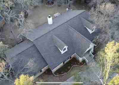 A storm damaged roof that we repaired and then did a full shingle replacement on a home in Leander Texas.