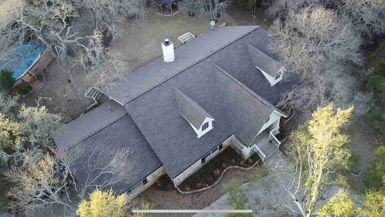 Storm damaged roof that we repaired on a home in Leander Texas.