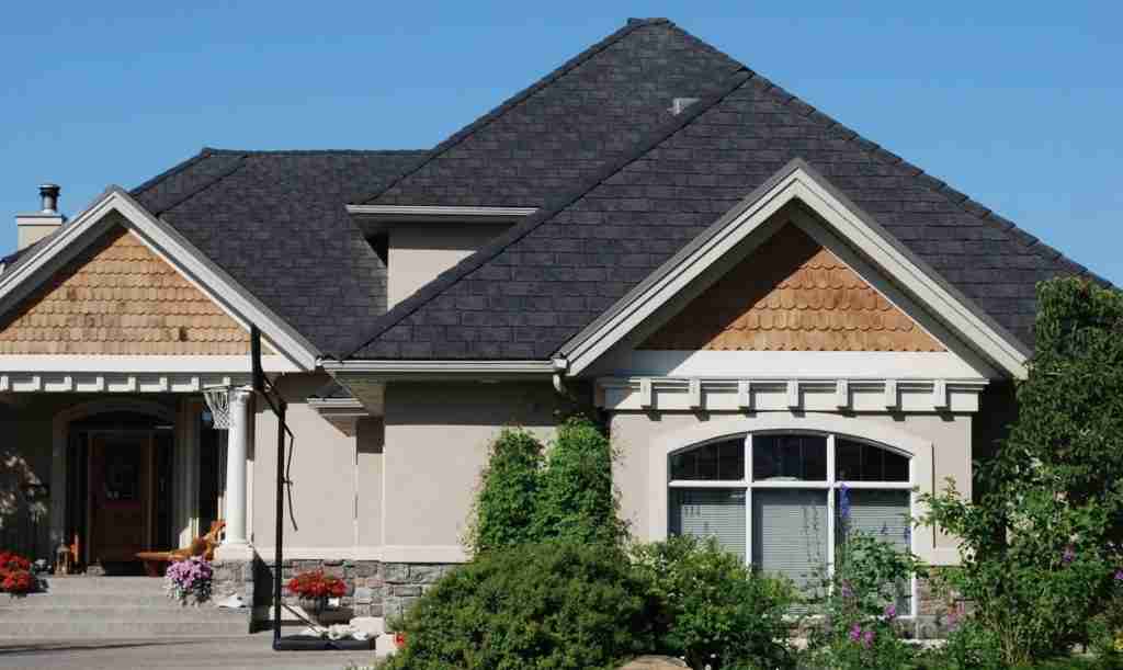 New roof installation using Euroshield Rundle Slate Roofing Shingles turn this home into an elegant beauty