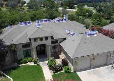 A roof and gutter replacement with the GAF roofing system and Timberline HDZ shingles in Marble Falls Texas