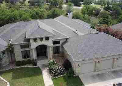 A roof and gutter replacement with the GAF roofing system and Timberline HDZ shingles in Marble Falls Texas