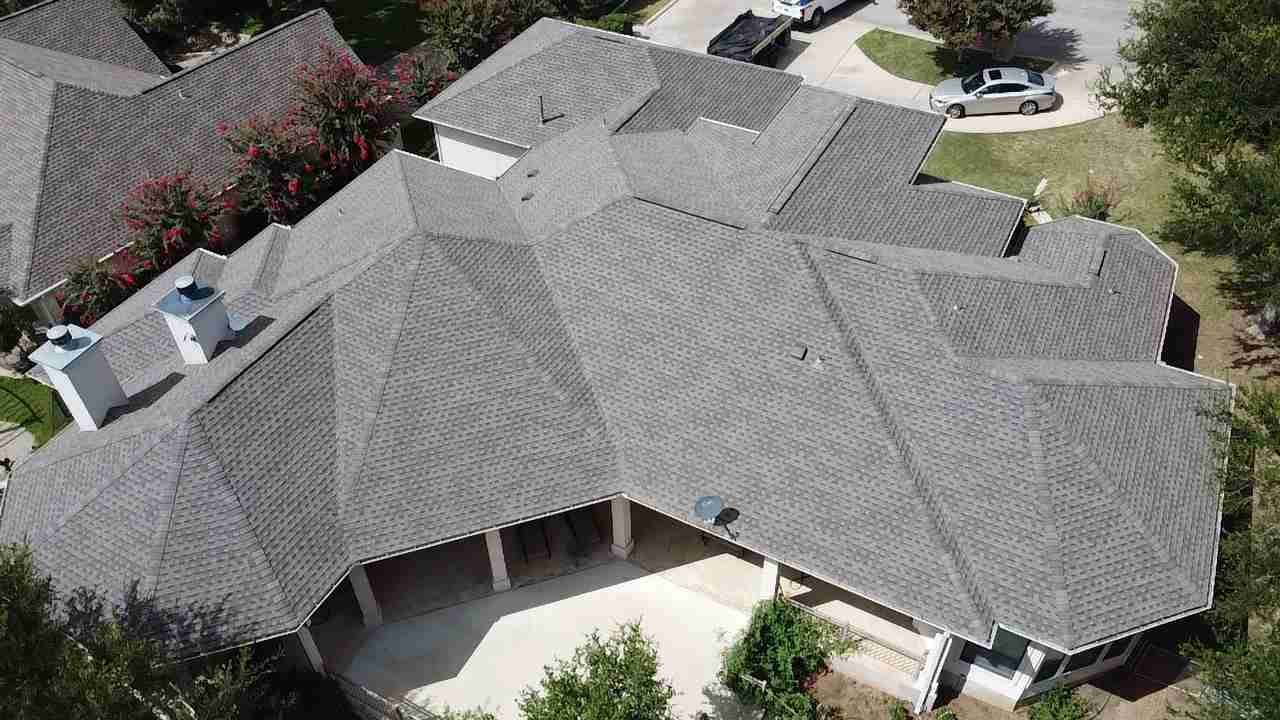 A roof replacement done by Badon Solutions on a home in Marble Falls Texas using the GAF roofing system with Timberline HDZ shingles and a 10 year workmanship warranty with a full gutter replacement and homeowner insurance claim