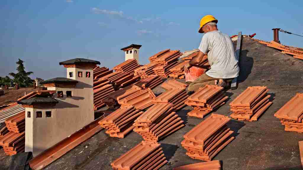 Tile Roofer installing a clay tile roof on a home