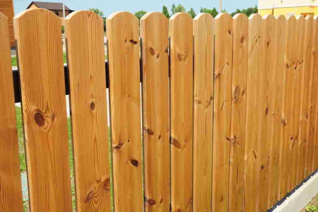 A spaced picket wood privacy fence at a home in Texas