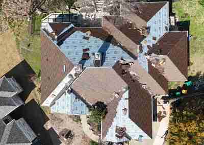 A roof replacement job in Meadowlakes Texas using Euroshield's hail-proof, recycled rubber, Beaumont Shake shingles.