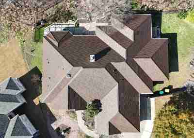 A roof replacement job in Meadowlakes Texas using Euroshield's hail-proof, recycled rubber, Beaumont Shake shingles.