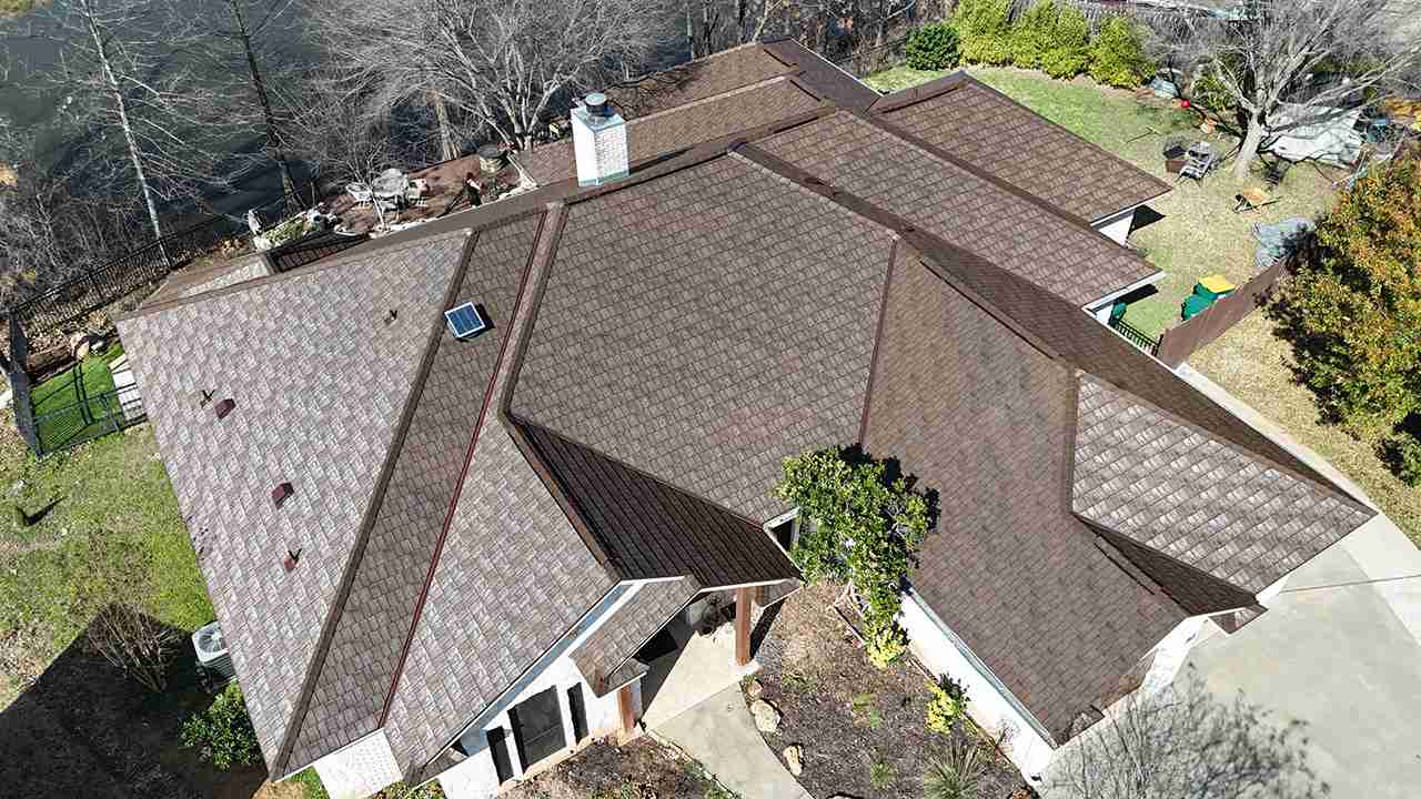 A roof replacement job in Meadowlakes Texas using Euroshield's hail-proof, recycled rubber, Beaumont Shake shingles.