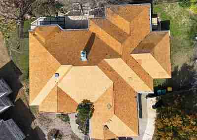 A roof replacement job in Meadowlakes Texas using Euroshield's hail-proof, recycled rubber, Beaumont Shake shingles.
