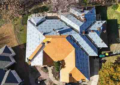 A roof replacement job in Meadowlakes Texas using Euroshield's hail-proof, recycled rubber, Beaumont Shake shingles.
